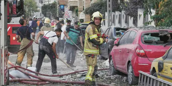 Iran strikes Israel, killing three, after Israeli attacks kill dozens in Tehran